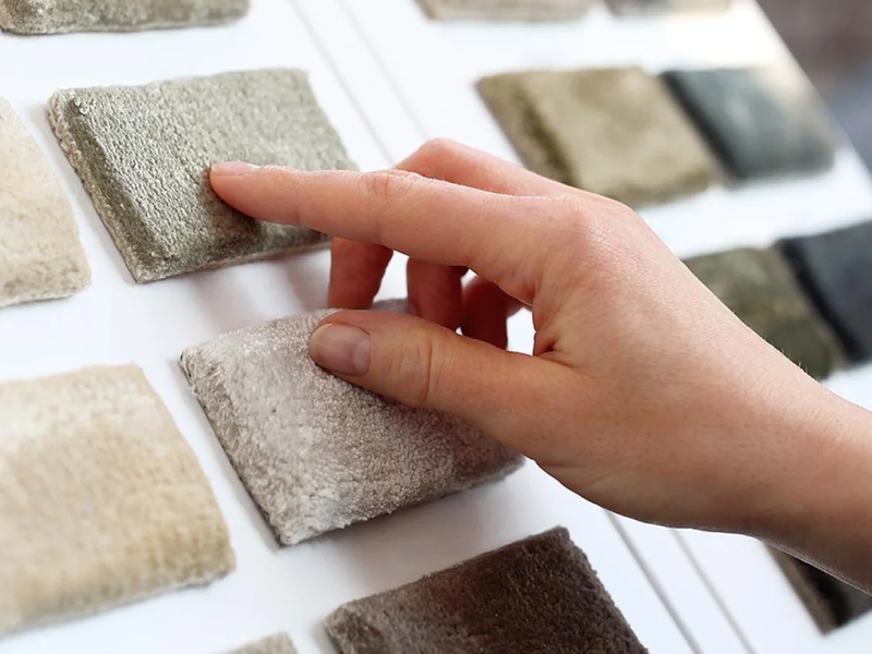 Person looking at carpet samples