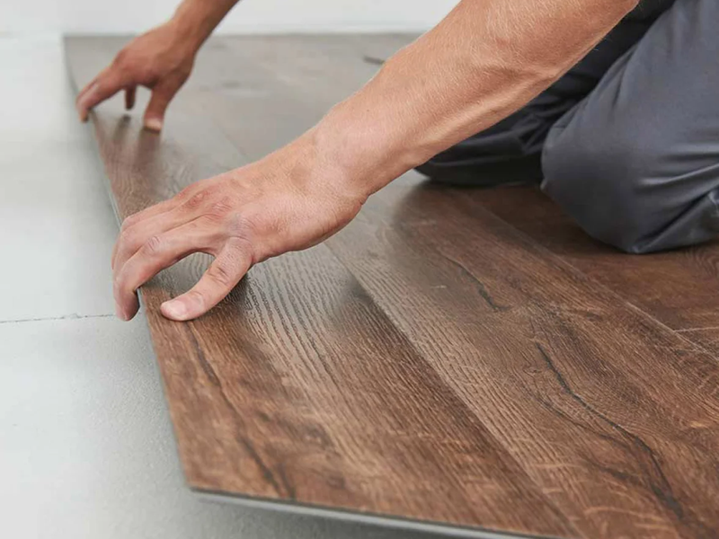 Flooring professional installing hardwood